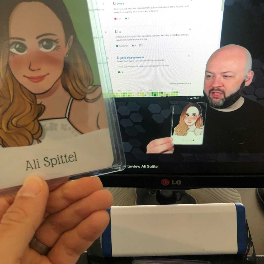 Mike Jolley on stream while holding up a card